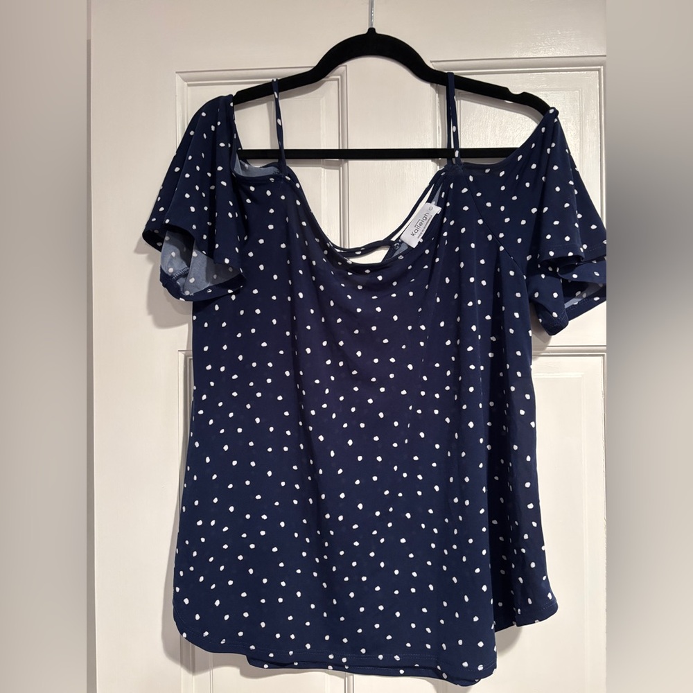 Blue and white polkadot polyester/spandex off the shoulder.